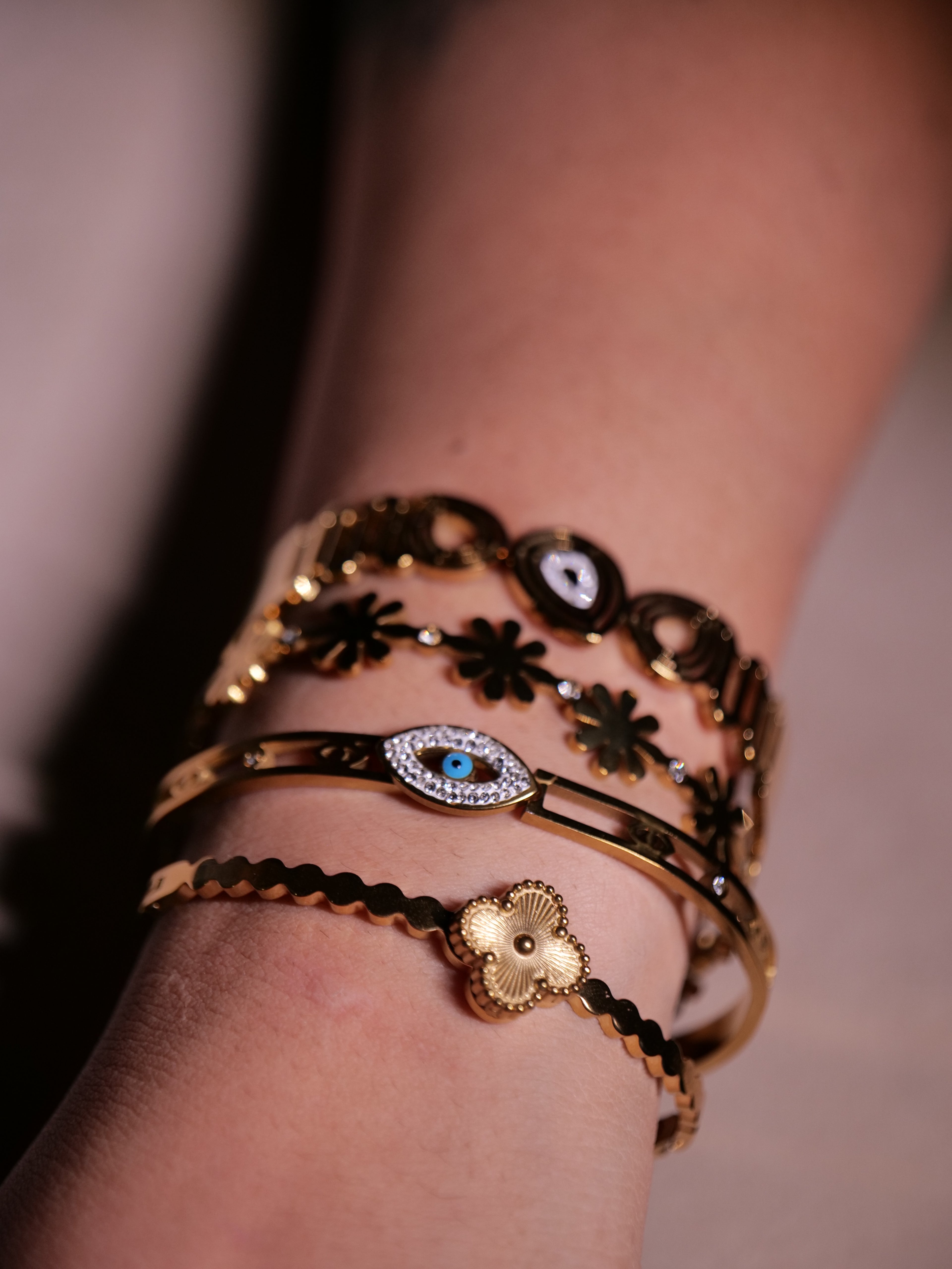 Gold statement bracelets