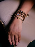 Gold statement bracelets